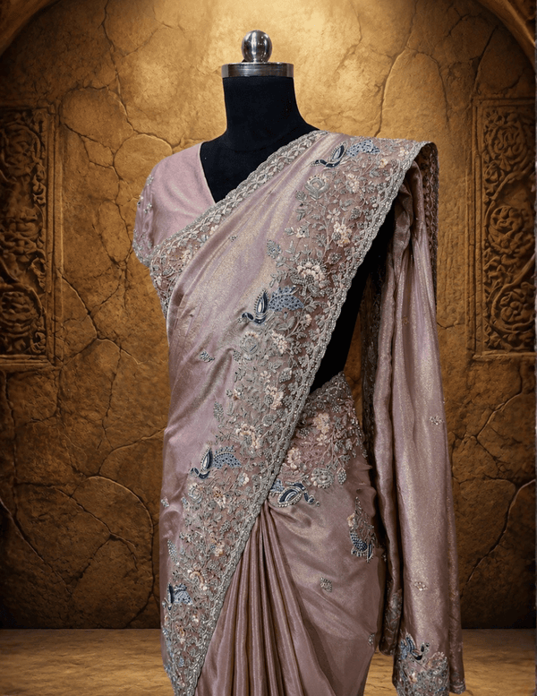 Portrait view of the matching lavender blouse, highlighting the detailed thread work and sparkling stone embellishments along the sleeves.