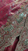 Beautiful close-up of the scalloped saree pallu edge featuring intensive multi-material handwork and premium, clean edge finishing.