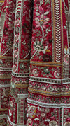 Cherry red lehenga in pure silk featuring heavy manual Zarkan and white pulse pearl embroidery.
