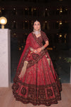 CRIMSON RED RAW SILK AND MAROON VELVET INFUSED LEHENGA