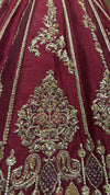 Detailed macro shot of the lehenga border showcasing intricate sequence work, cut beads, and traditional zardozi patterns.