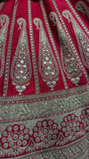 Detailed view of the manual handwork on the pink lehenga, showing white beadwork trees, deer motifs, and sequins.