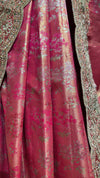 Detailed view of the saree border showing the wave-like layouts of glittering sequence lines and delicate tone-on-tone resham flowers.