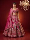 Full-length front view of the pink lehenga ensemble on a model, highlighting the voluminous silk skirt and matching dupatta.