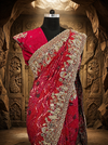A front-view studio portrait of the mannequin highlighting the neat pleating of the saree and the contrast of the heavily ornamented scalloped border against a soft light source.