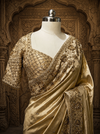 A close-up studio presentation focusing on the matching short-sleeved blouse, showcasing its dense, diamond-grid sequin work, delicate sweetheart neckline, and beaded sleeve trims.