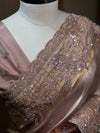 A close-up perspective of the upper bodice showing the structured neckline of the matching mauve blouse, layered elegantly with the detailed peacock threadwork across the border.