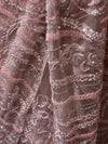 Macro photograph focusing on the soft net fabric folds, revealing delicate linear embroidery, tone-on-tone sequins, and micro cutdana beadwork.