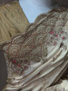 Close-up view of the scalloped shoulder border, showing the dense arrangement of metallic zardozi, cutdana, and pink Resham thread highlights.
