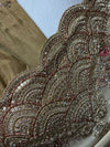 Texture close-up highlighting the contrast between the smooth shimmer tissue base and the heavily encrusted scalloped embroidery.