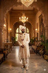 Elegant ivory sherwani for groom with intricate embroidery for a royal wedding look
