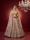 Luxury pink bridal lehenga with intricate hand embroidery and dupatta
