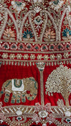 Luxury red bridal lehenga with intricate nakshi and embroidery
