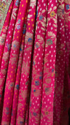 Macro view of the exquisite blouse embroidery showcasing geometric lines of gold zari and tightly packed cut beads.