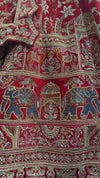 Premium red lehenga for wedding priced at 84,500 featuring traditional Indian manual craftsmanship and zari.