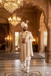Ivory groom sherwani with detailed thread and stone work for elegant wedding attire