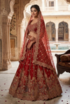 Luxury red silk lehenga for bride with heavy sequins, thread and stone work, perfect Indian wedding bridal outfit
