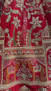 Red lehenga choli in pure silk featuring heavy manual Zarkan and white pulse pearl embroidery.