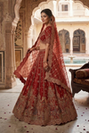 Designer red bridal lehenga in silk with handcrafted dori, resham thread and stone embroidery for traditional wedding
