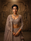 Full back profile of the lavender net lehenga ensemble, showcasing the cleanly tailored blouse back and the fluid, sweeping flare of the skirt.