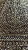 Detailed view of the lehenga skirt panels, showcasing the structural geometric patterns made of sparkling sequins and kardana beads.