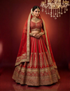 Full-length view of a pure red bridal lehenga in silk with heavy Neem Zari embroidery.