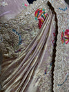 Beautiful close-up of the scalloped saree pallu corner featuring intensive multi-material handwork and clean, premium edge finishing.